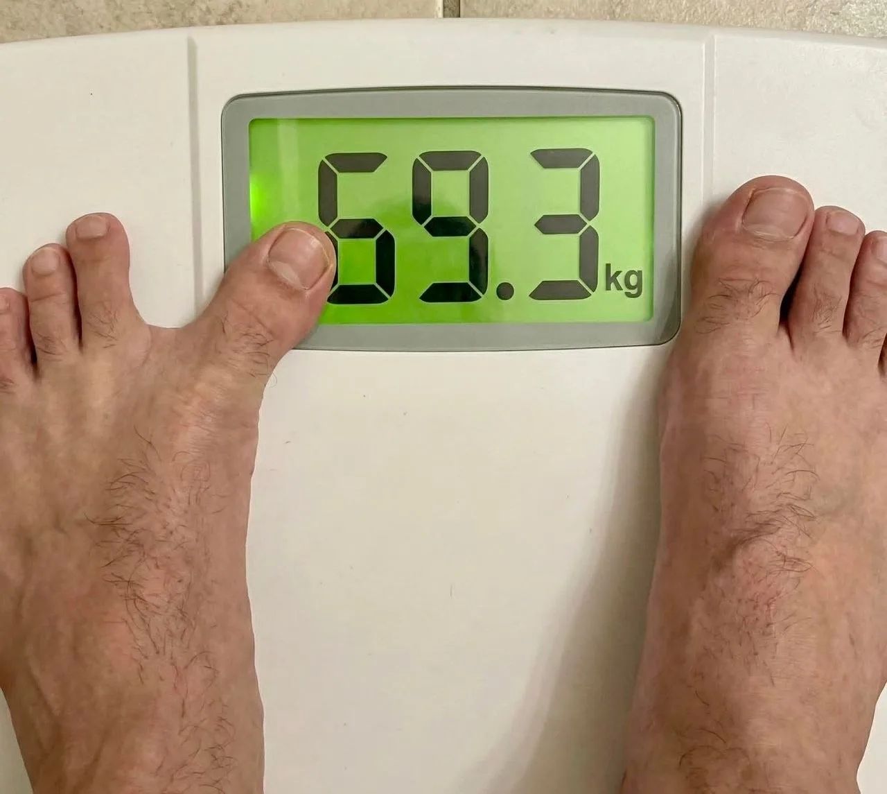 59.3 kg