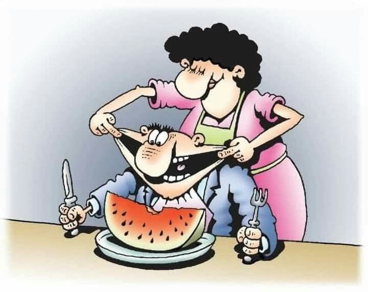 Карикатура: женщина кормит мужчину арбузом, он широко открывает рот за столом.