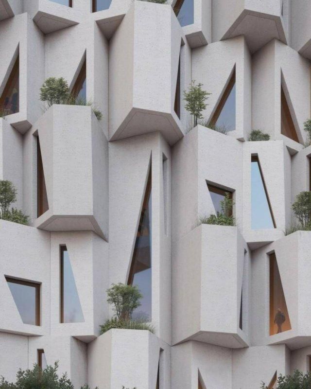 Странная архитектура: белые выпуклые окна с растениями на фасаде.